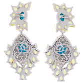 Elegant pear blue turquoise sterling silver earrings with intricate design and accent stones for a luxurious look.